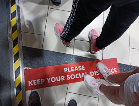 Antalya, Turkey - September 26, 2021: Breaking the Social Distancing norm by stepping on it view at a queue in coffee shop, new normal worldwide to prevent spreading the virus fluのeditorial素材