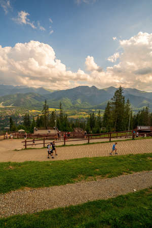 Zakopane, Poland - August 13, 2021: Tourist hiking or trekking to gubalowka mountain in Zakopane against giewont mountains in the backgroundのeditorial素材