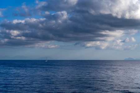 Landscape view of a blue water in mediterranean sea in dramatic cloud located in Zante, Zakynthos island of Greeceの写真素材