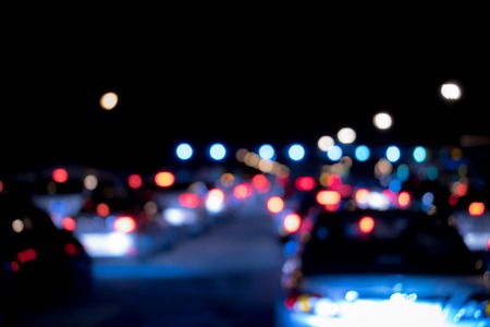 color Light night at city blue bokeh abstract black background blur lens flare reflection beautiful circle glitter lamp street with dark sky festivalの写真素材