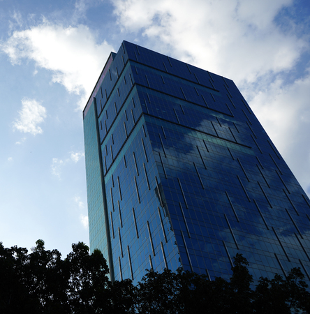 low angle view of skyscrapers Business Office with blue sky, Corporate building in city.