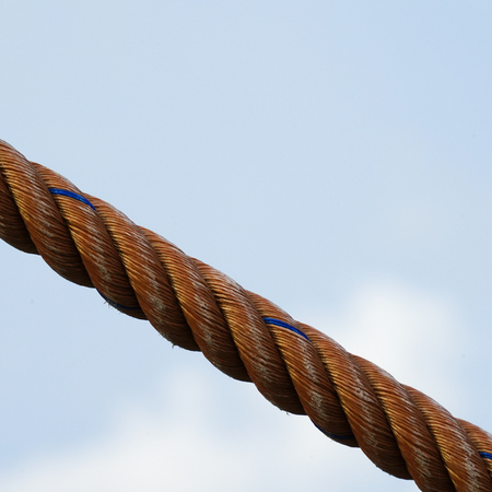 Rope texture thread cord hemp closeup against sky background.