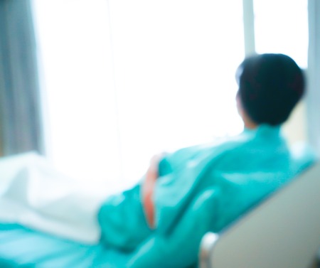 Blurred patient on bed in Hospital standard VIP room with beds and comfortable medical equippedの写真素材