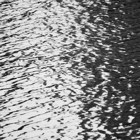 blue water surface background texture blurred light with wave ripple nature abstract.の写真素材