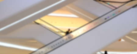 blurred touris on sky walk in department store background texture