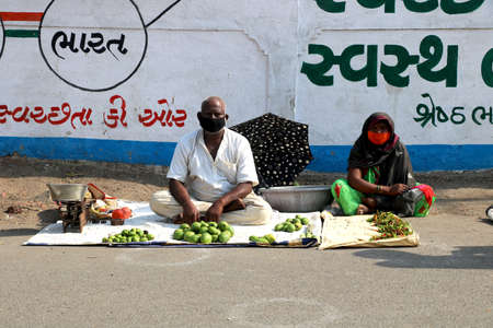 City Valsad, state Gujarat, country-India 20/04/2020 people are buying vegetable and fruit during...