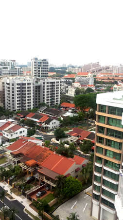 aerial view of big modern building and old vintage apartment blue sky of singapore city