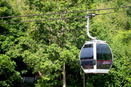 Country- Malaysia City-Langkawi Date 04/16/2020 close up view of cable car cabin with background of treesのeditorial素材