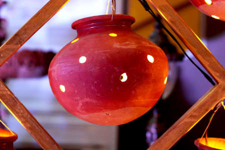 Clay port is decorator with light coming out from hole, decoration for wedding and partyの写真素材