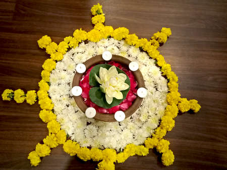 Flower decoration with candle on wooden floorの写真素材