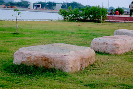Big stone on grass in gardenの写真素材
