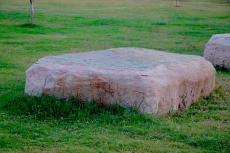 Big stone on grass in gardenの写真素材