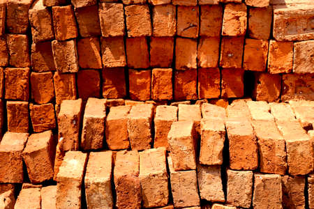 Stack of red bricks for construction purposeの写真素材