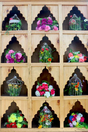 metallic bowl and flower decoration on wooden showcase use in wedding eventの写真素材