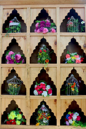 metallic bowl and flower decoration on wooden showcase use in wedding event