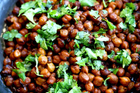 Indian chickpea dish(chana masala) with coriander laves garnish on topの写真素材