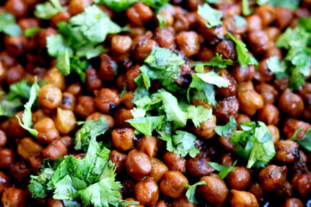 Indian chickpea dish(chana masala) with coriander laves garnish on topの写真素材