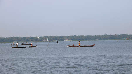 Net fishing in traditional fishing boat. Kerala. Indiaの写真素材
