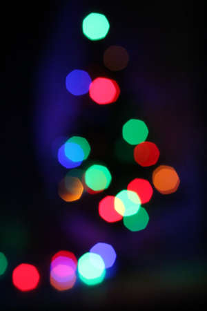 Christmas light tree decoration in dark with blur backgroundの写真素材