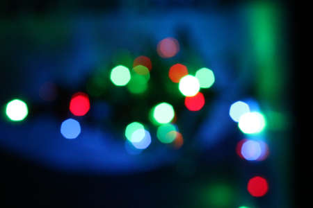 Christmas light tree decoration in dark with blur backgroundの写真素材