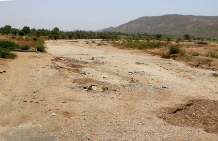 View of dry river in India with background of nature and mountainの写真素材