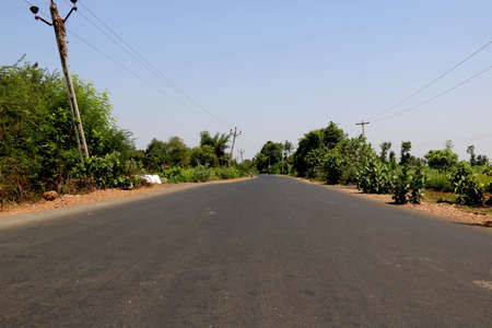 Rural Roads in India leading to the village at the distanceの写真素材