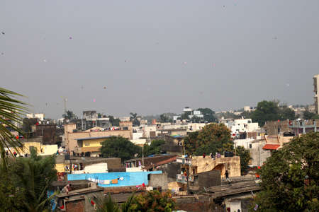 Country-India, State- Gujarat, City- valsad Date 14-01-2021 Group of people gather to fly kites on top of terraceのeditorial素材