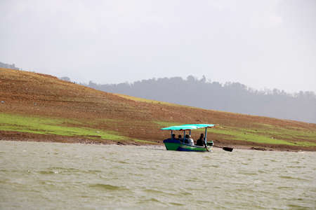 landscape view of ferry boat with tourist for ride in lake of dudhni (India)の写真素材