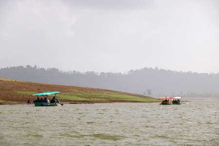 landscape view of ferry boat with tourist for ride in lake of dudhni (India)の写真素材