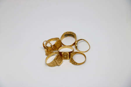 Different gold rings with white backgroundの写真素材