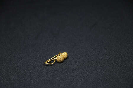 Gold ring jewelry on black backgroundの写真素材