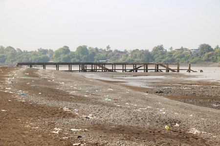 Beautiful tranquil scene of empty sand beach with jetty at valsad, Gujrat , Indiaの写真素材