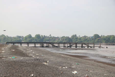 Beautiful tranquil scene of empty sand beach with jetty at valsad, Gujrat , Indiaの写真素材