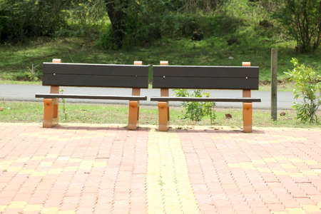 Rcc bench near road side for resting of long travel passenger bench, sitting, outdoor, green trees, road, design, street, exterior, aged, plank, chair, wood, relax, decoration, view, park, nature, furniture, seat, relaxation, garden, hardwood, object, board, wooden, rough, empty, decorative, concept, sit, flat, comfortable, rest, background, bench park, seat chair and sofa, trees and wood, concrete bench, bench in gardenの写真素材
