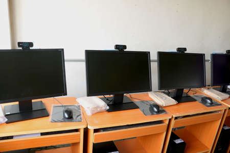 computer lab at school computers on tableの写真素材