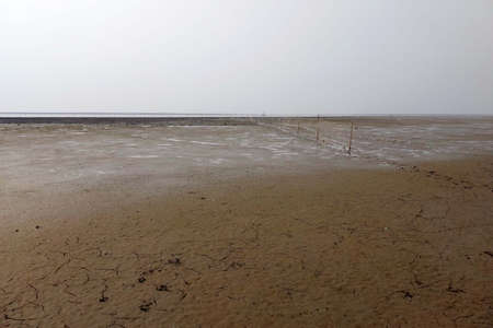 Fishing net ties on beachの写真素材