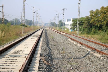 Empty straight single-way railways at summer sunny day.の写真素材