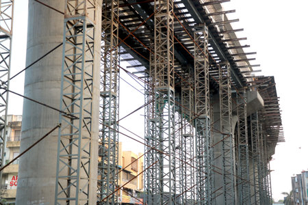 Steel structure under construction with scaffolding, closeup of photo.の写真素材