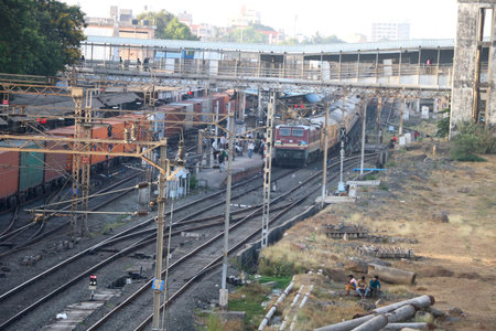 Indian goods and passenger train has stopped at rail stationの写真素材