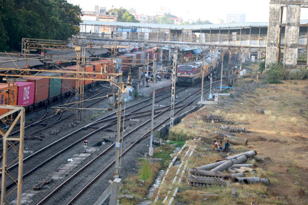 Indian goods and passenger train has stopped at rail stationの写真素材