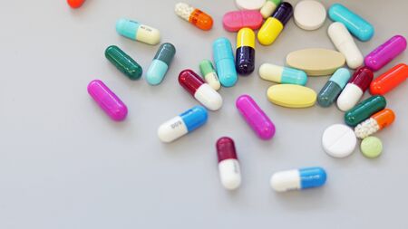 Colorful tablets, pills and capsules medicine using for treatment and cure the disease or sickness. Drug prescription using for medication in medical clinic, pharmacy Pharmaceutical service concept.の写真素材