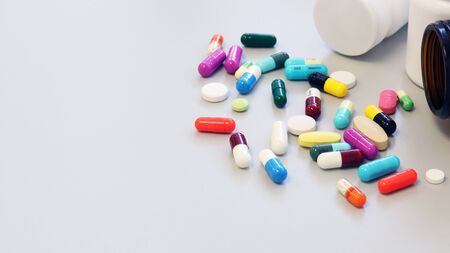 Colorful tablets, pills and capsules medicine using for treatment and cure the disease or sickness. Drug prescription using for medication in medical clinic, pharmacy Pharmaceutical service concept.の写真素材