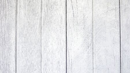 Vintage white hardwood dirty and rough wall. Old style and classic surface table. Fence panel painted with bright color. Use as pattern, texture and wallpaper background. Has copy space for texts.の写真素材
