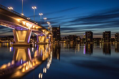 Illuminated bridge at sunset