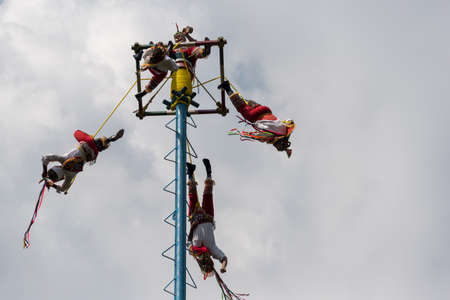 Otomi people perform the traditional Dance of the Flyers. An ancient ritual dating back 1,500 years. Celebration is performed in the Parque de Chapultepec in Mexico city in front of Touristsのeditorial素材