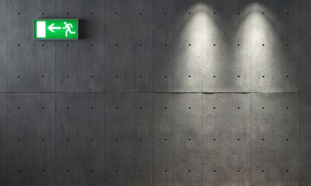 background texture of concrete wall with two spotlights and an emergency exit signalの写真素材