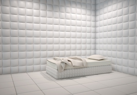 white mental hospital padded room corner with a bedの写真素材