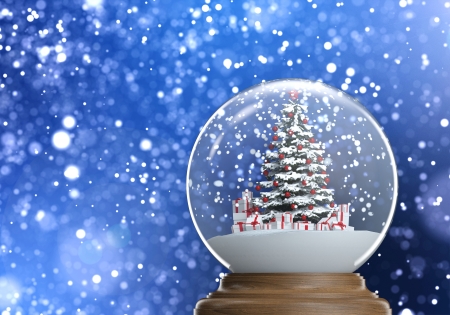 snowglobe with red decorated christmas tree and presents inside on a blue winter defocused background,