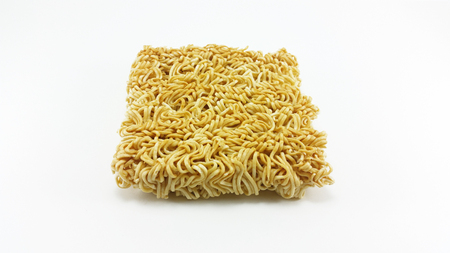 uncooked instant noodle in white backgroundの写真素材