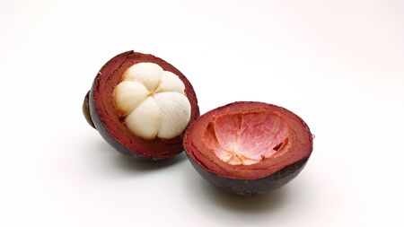 Ripe fresh mangosteen - the asian fruit on white backgroundの写真素材